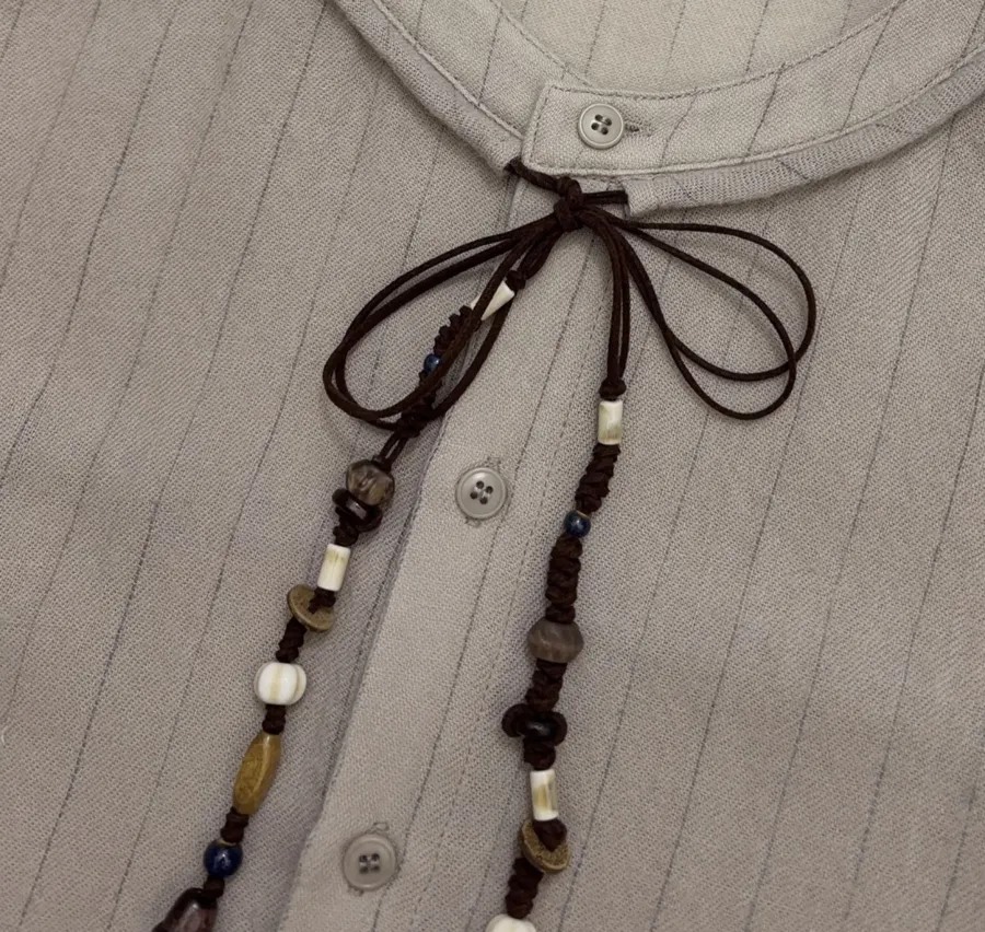Niche Round-Neck Striped Jacquard Loose Wool Shirt with Wooden Bead Tassel in Taupe, product view 05