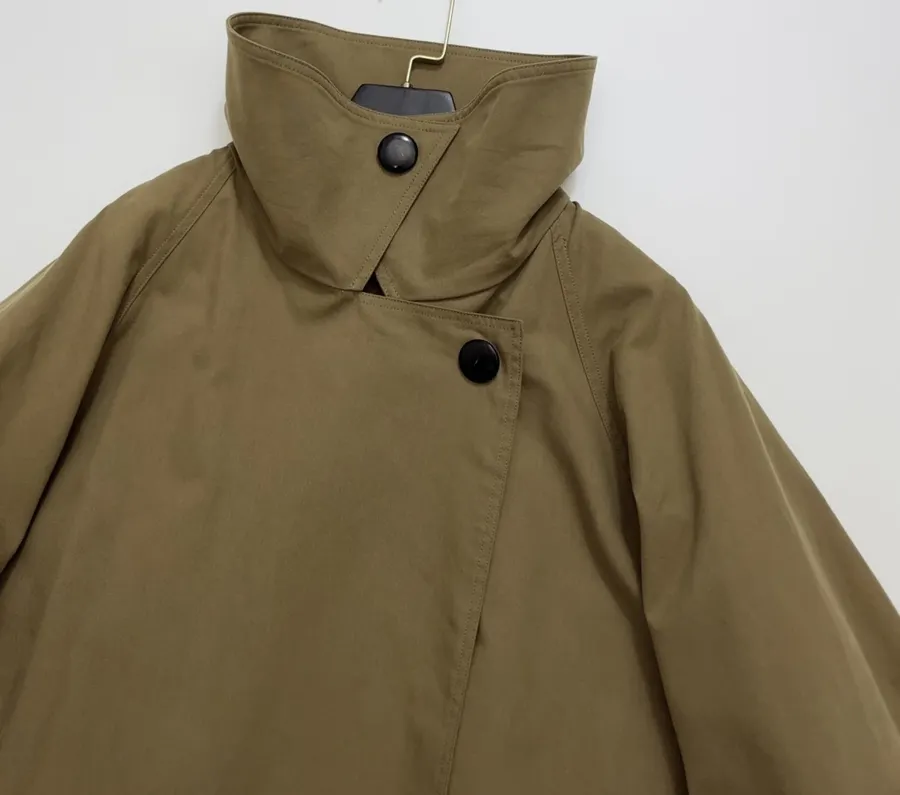 The Row Cotton Aurore trench coat with structured silhouette, diagonal front closure, and three-quarter sleeves in As Shown, product view 04