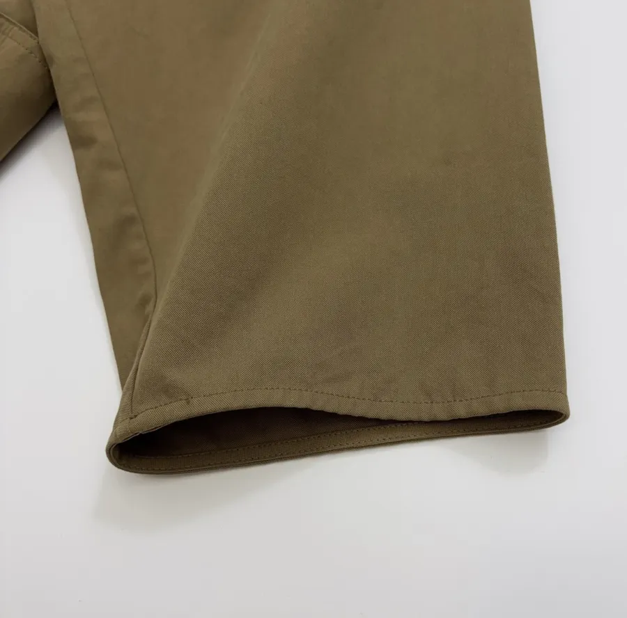 The Row Cotton Aurore trench coat with structured silhouette, diagonal front closure, and three-quarter sleeves in As Shown, product view 09