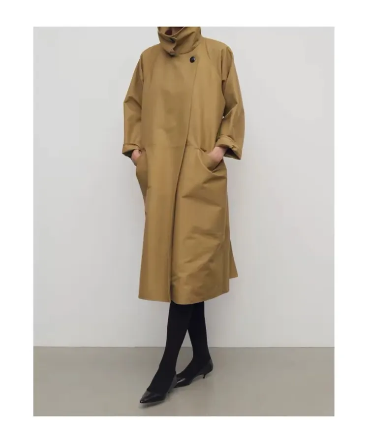 The Row Cotton Aurore trench coat with structured silhouette, diagonal front closure, and three-quarter sleeves in As Shown, product view 28